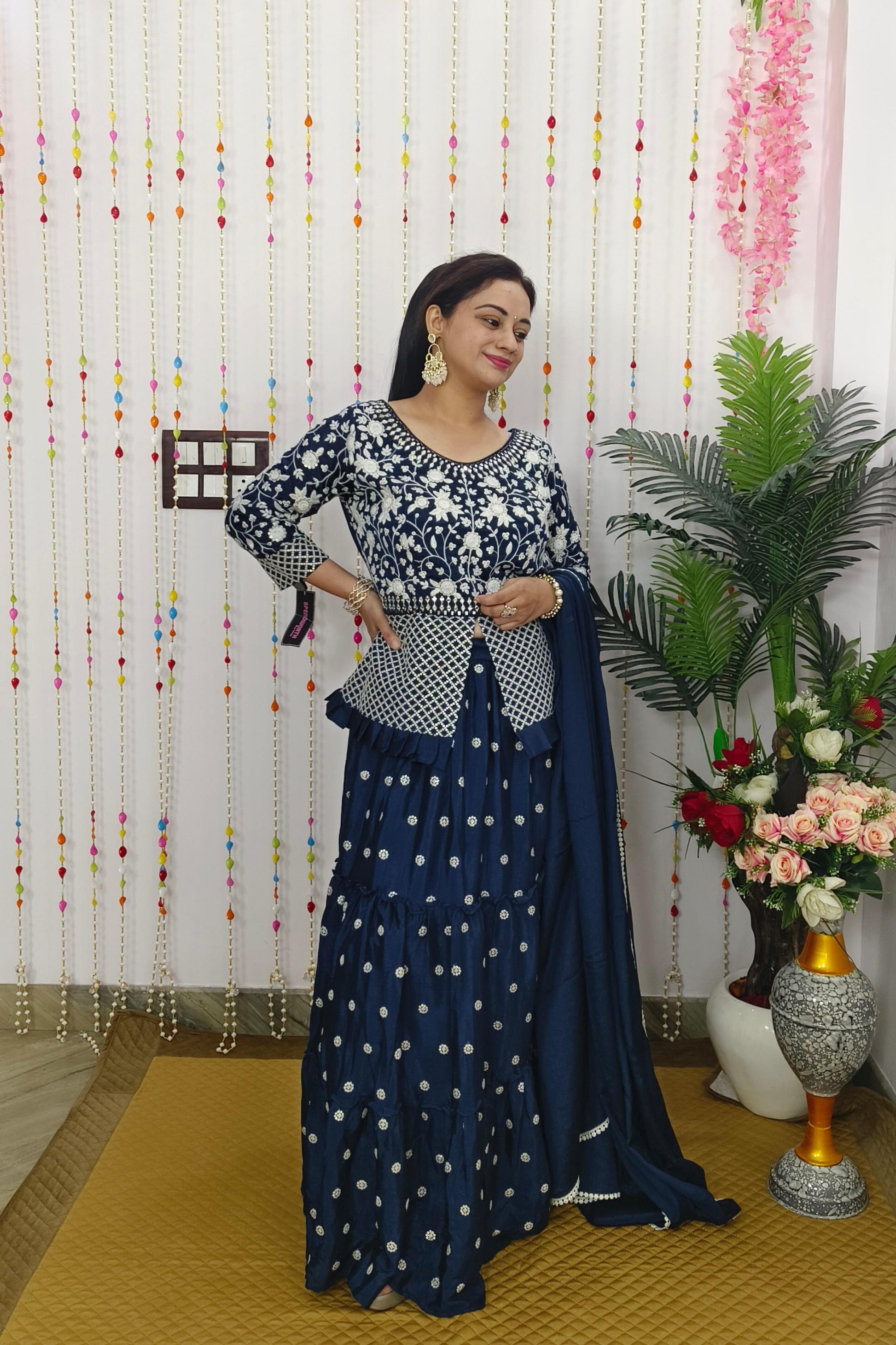 peplum indo western dress Brindha Collection Premium Indo-western Top & Skirt Top: Premium indowestern peplum top featuring intricate yoke and sleeve designs, a stylish high-low peplum cut with sheer transparency. Skirt: Full flared skirt crafted from