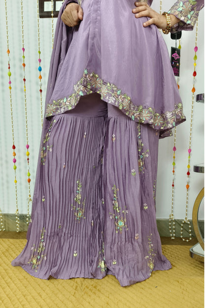 Partywear Embroidered Peplum Sharara Suit With Front Slit High Low Designing In Chinnon