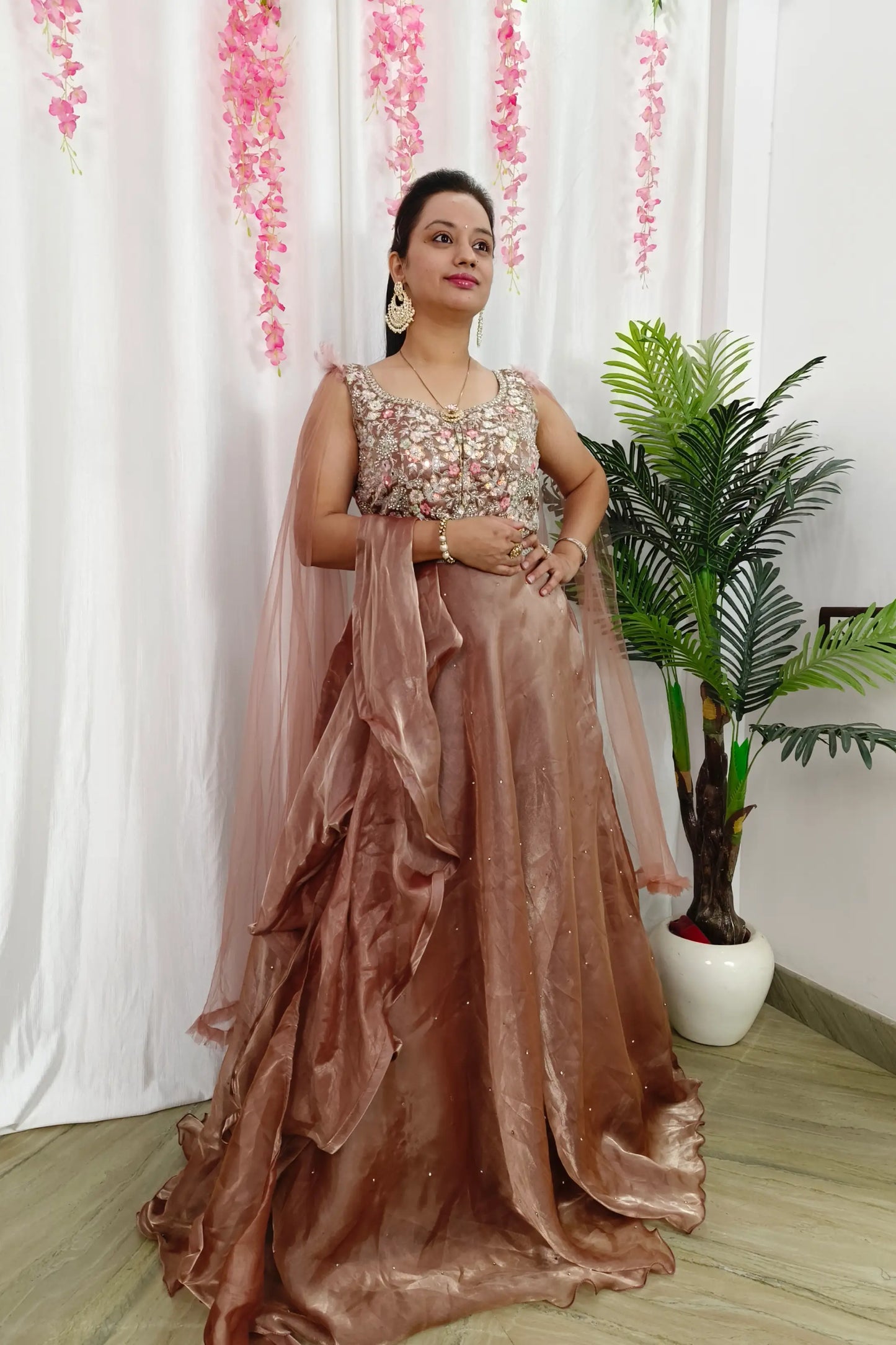 Designer Feather Sleeves Partywear Organza Gown In Mettalic Brown Colour