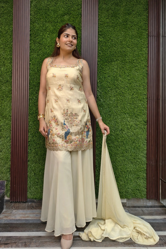 Pure Chinnon Silk Embroidered Sharara Suit In Light Gold