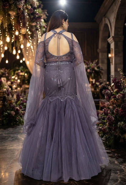 Stylish Hand Embellished Mesh Net Fish Cut Lehenga & Falling Cape Sleeves with Halter Neck Blouse