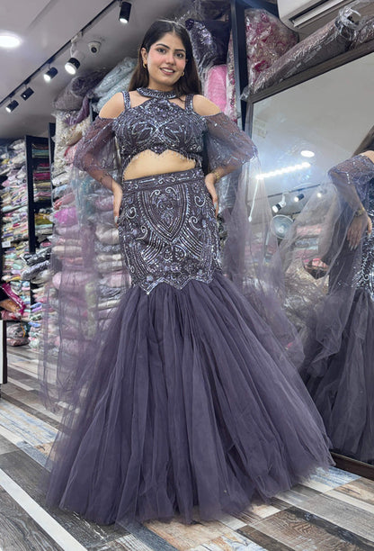Stylish Hand Embellished Mesh Net Fish Cut Lehenga & Falling Cape Sleeves with Halter Neck Blouse