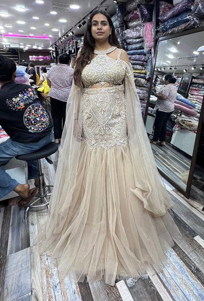 Stylish Hand Embellished Mesh Net Fish Cut Lehenga & Falling Cape Sleeves with Halter Neck Blouse
